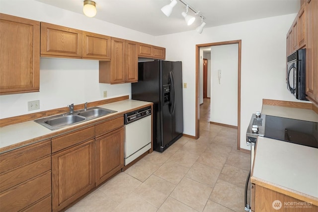 1312 S Massachusetts St Unit 202, Seattle, WA 98144 - kitchen featuring black appliances, brown cabinetry, light countertops, and track lighting