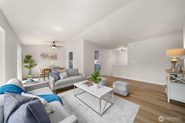 5201 S 298th Ct, Auburn, WA 98001 - living room with wood finished floors, ceiling fan, and a textured ceiling
