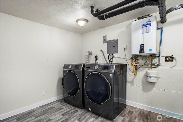 2855 SW 300th Pl, Federal Way, WA 98023 - laundry area featuring electric panel, separate washer and dryer, tankless water heater, wood finished floors, and a textured ceiling