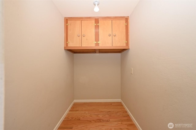 3722 27th Pl W Unit 301, Seattle, WA 98199 - washroom featuring light wood-style floors and baseboards