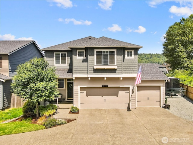 902 Van Ogle Ln NW, Orting, WA 98360 - traditional-style house featuring concrete driveway, roof with shingles, and a garage