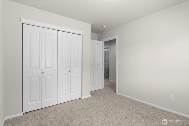 902 Van Ogle Ln NW, Orting, WA 98360 - unfurnished bedroom featuring carpet and a closet