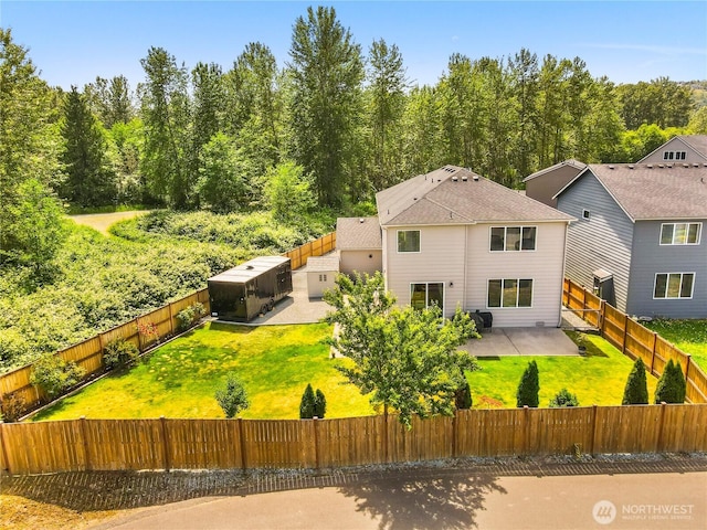 902 Van Ogle Ln NW, Orting, WA 98360 - back of house with a patio, a fenced backyard, and a forest view