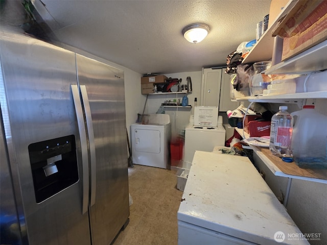 2719 Pacific Ave, Hoquiam, WA 98550 - kitchen featuring stainless steel fridge with ice dispenser, washing machine and dryer, open shelves, a textured ceiling, and concrete flooring