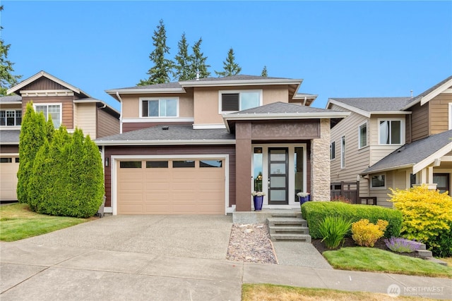 2511 124th Pl SE, Everett, WA 98208 - view of front of home featuring driveway, an attached garage, stucco siding, stone siding, and roof with shingles