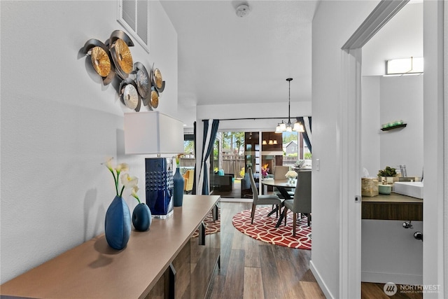 2511 124th Pl SE, Everett, WA 98208 - hallway featuring dark wood-style flooring and a chandelier