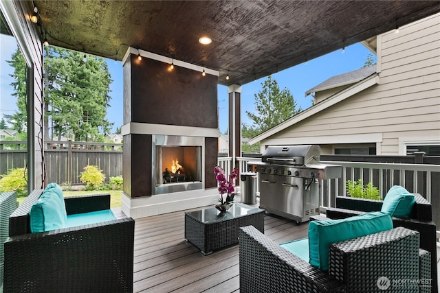 2511 124th Pl SE, Everett, WA 98208 - wooden terrace with area for grilling and an outdoor living space with a fireplace