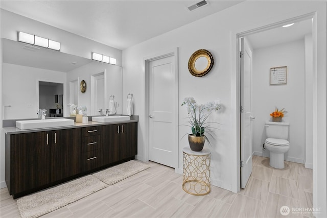 2511 124th Pl SE, Everett, WA 98208 - bathroom featuring double vanity and toilet