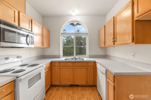 6317 Barstow Ln SE Unit 8, Lacey, WA 98513 - kitchen with white appliances, light countertops, and light wood-style flooring