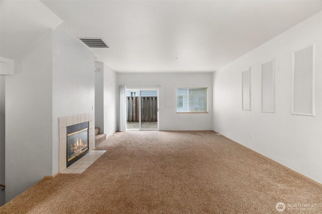 6317 Barstow Ln SE Unit 8, Lacey, WA 98513 - unfurnished living room featuring light carpet and a tile fireplace