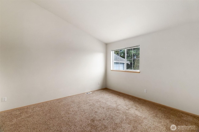 6317 Barstow Ln SE Unit 8, Lacey, WA 98513 - spare room with carpet flooring and lofted ceiling