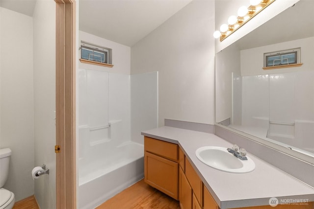 6317 Barstow Ln SE Unit 8, Lacey, WA 98513 - full bathroom featuring vanity, wood finished floors, and shower / washtub combination