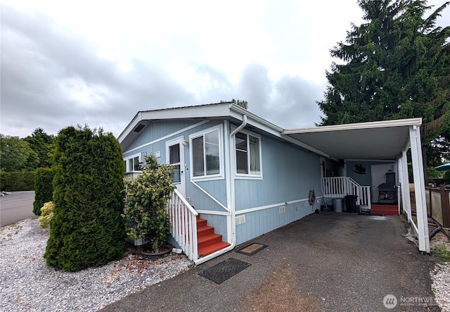 1200 Lincoln St Unit 154, Bellingham, WA 98229 - manufactured / mobile home with a carport, entry steps, crawl space, and asphalt driveway
