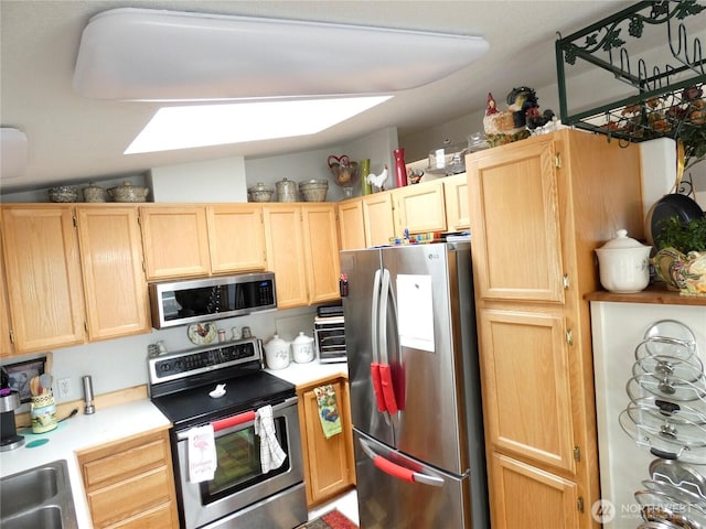 1200 Lincoln St Unit 154, Bellingham, WA 98229 - kitchen with stainless steel appliances, light brown cabinets, and light countertops