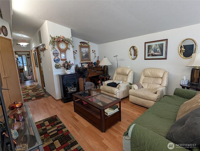 1200 Lincoln St Unit 154, Bellingham, WA 98229 - living room featuring light wood finished floors and a textured ceiling