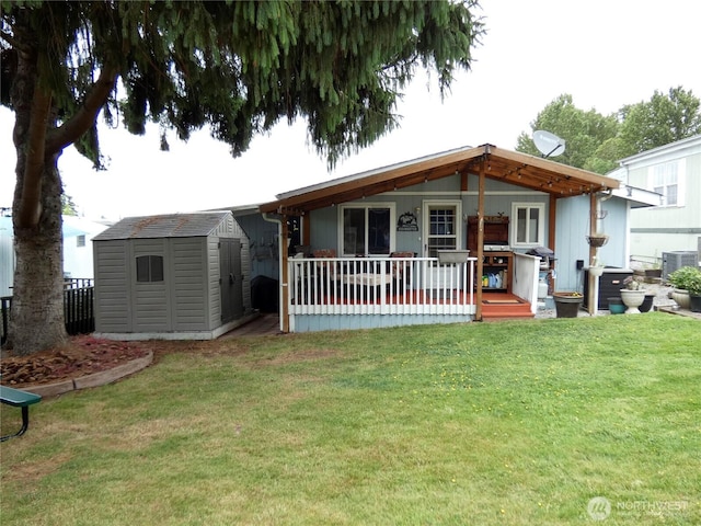 1200 Lincoln St Unit 154, Bellingham, WA 98229 - rear view of property with a storage unit and a yard