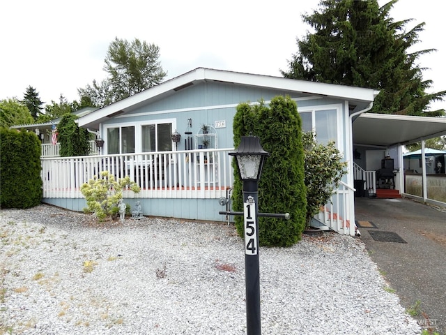 1200 Lincoln St Unit 154, Bellingham, WA 98229 - manufactured / mobile home with driveway and a carport