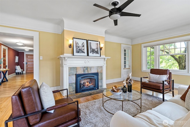 219 N Tacoma Ave Unit A205, Tacoma, WA 98403 - living room with a tile fireplace, a ceiling fan, wood finished floors, and crown molding