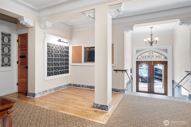 219 N Tacoma Ave Unit A205, Tacoma, WA 98403 - foyer featuring wood finished floors, a chandelier, ornamental molding, and french doors