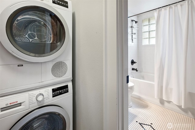 219 N Tacoma Ave Unit A205, Tacoma, WA 98403 - washroom featuring stacked washer / dryer and tile patterned floors