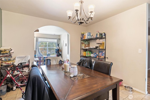 6725 159th St E, Puyallup, WA 98375 - dining area with arched walkways, light tile patterned floors, and a chandelier