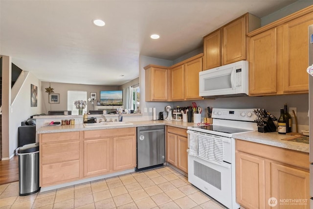 6725 159th St E, Puyallup, WA 98375 - kitchen with white appliances, a peninsula, light countertops, light brown cabinets, and recessed lighting