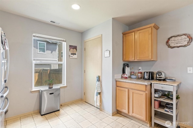 6725 159th St E, Puyallup, WA 98375 - kitchen featuring light countertops, light brown cabinetry, recessed lighting, and freestanding refrigerator
