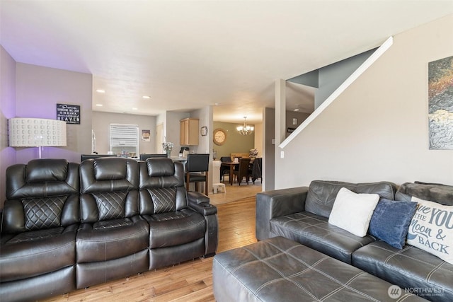 6725 159th St E, Puyallup, WA 98375 - living area with light wood-style flooring and a chandelier