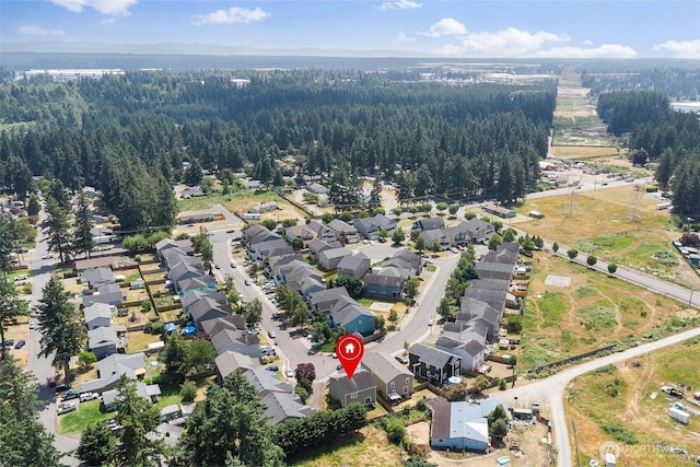 6725 159th St E, Puyallup, WA 98375 - aerial view of property and surrounding area featuring nearby suburban area and a forest
