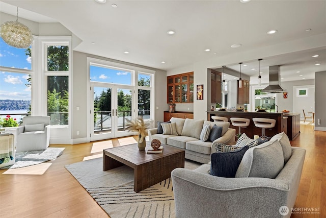 8246 W Mercer Way, Mercer Island, WA 98040 - living room with light wood finished floors, recessed lighting, and french doors