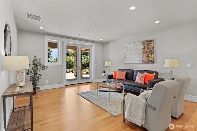 8246 W Mercer Way, Mercer Island, WA 98040 - living room with french doors, recessed lighting, and light wood finished floors