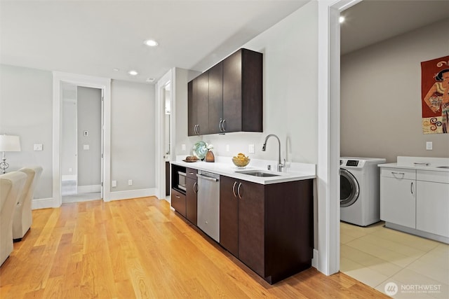 8246 W Mercer Way, Mercer Island, WA 98040 - kitchen featuring washer / dryer, dishwasher, dark brown cabinetry, light countertops, and recessed lighting