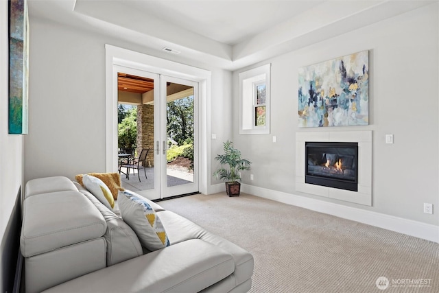 8246 W Mercer Way, Mercer Island, WA 98040 - carpeted living room with a glass covered fireplace and a tray ceiling