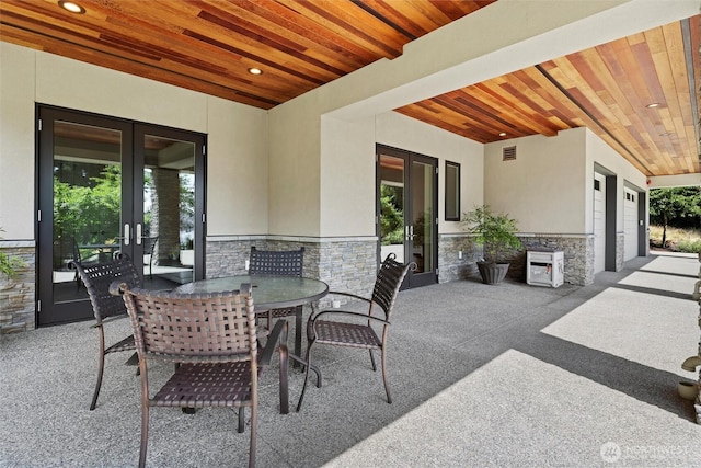 8246 W Mercer Way, Mercer Island, WA 98040 - view of patio featuring french doors and outdoor dining space