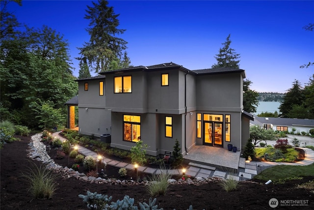 8246 W Mercer Way, Mercer Island, WA 98040 - back of house at dusk with stucco siding