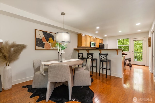 2674 SW Sylvan Heights Dr, Seattle, WA 98106 - dining area featuring light wood-style floors and recessed lighting