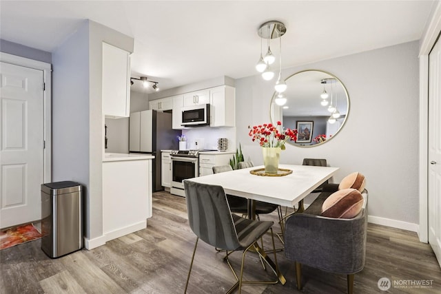 916 3rd Ave Unit A104, Kirkland, WA 98033 - dining space featuring wood finished floors