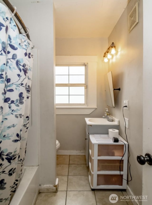 5229 S Thompson Ave, Tacoma, WA 98408 - full bathroom featuring vanity, tile patterned floors, and shower / tub combo