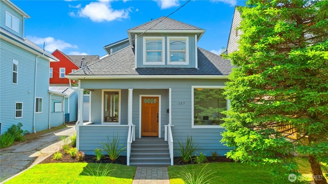 157 26th Ave, Seattle, WA 98122 - bungalow-style home with roof with shingles, asphalt driveway, covered porch, and a front yard