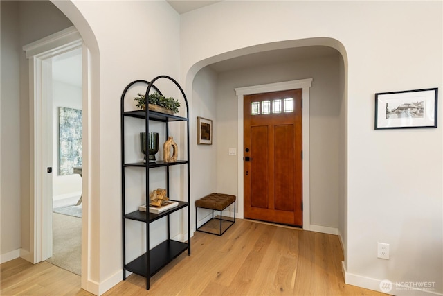 157 26th Ave, Seattle, WA 98122 - entryway with light wood-style floors and arched walkways