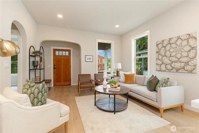 157 26th Ave, Seattle, WA 98122 - living room with arched walkways, light wood-style floors, and recessed lighting
