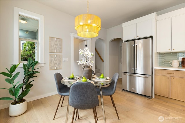 157 26th Ave, Seattle, WA 98122 - dining space featuring light wood-type flooring and stairs