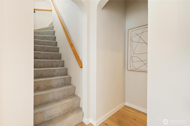 157 26th Ave, Seattle, WA 98122 - staircase featuring wood finished floors and arched walkways