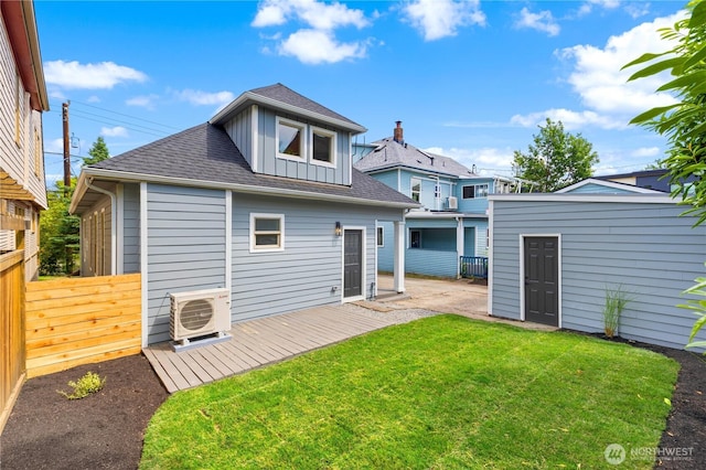 157 26th Ave, Seattle, WA 98122 - rear view of house featuring roof with shingles, an outbuilding, a wooden deck, and board and batten siding
