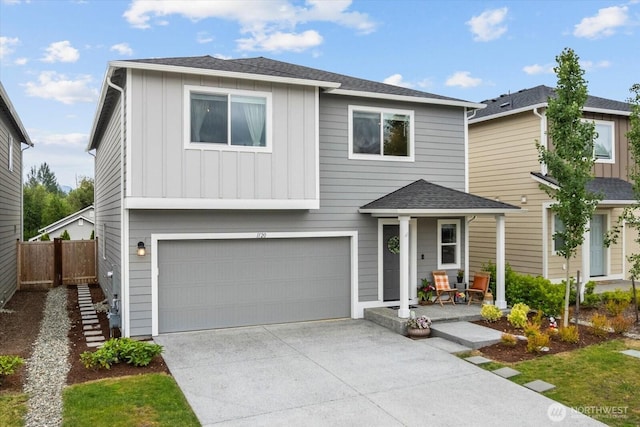 1120 15th Ave, Sultan, WA 98294 - view of front of house featuring board and batten siding, concrete driveway, an attached garage, and a shingled roof