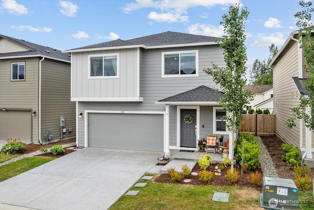 1120 15th Ave, Sultan, WA 98294 - traditional home with board and batten siding, roof with shingles, concrete driveway, and an attached garage