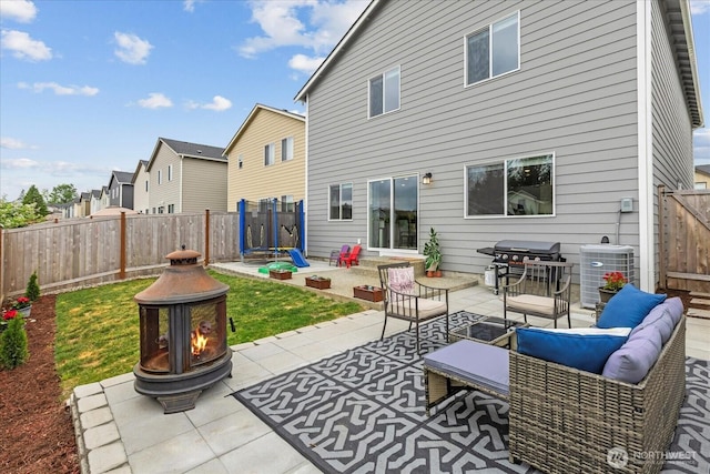 1120 15th Ave, Sultan, WA 98294 - fenced backyard with a patio area, a grill, outdoor lounge area, and a residential view