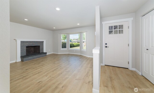 9621 1st Ave SE, Everett, WA 98208 - foyer entrance with light wood-style flooring, recessed lighting, and a fireplace