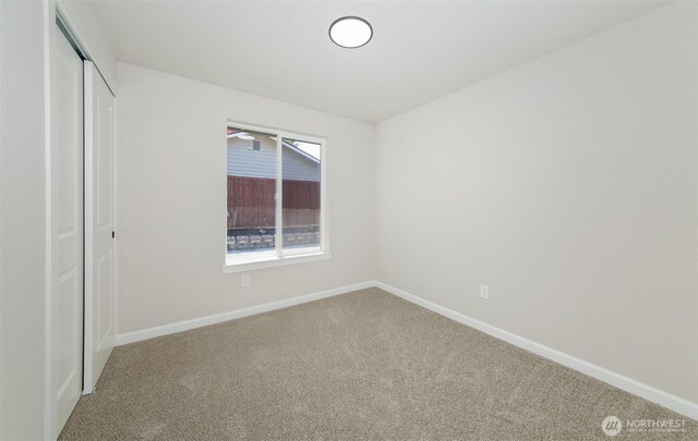 9621 1st Ave SE, Everett, WA 98208 - unfurnished bedroom featuring carpet floors and a closet
