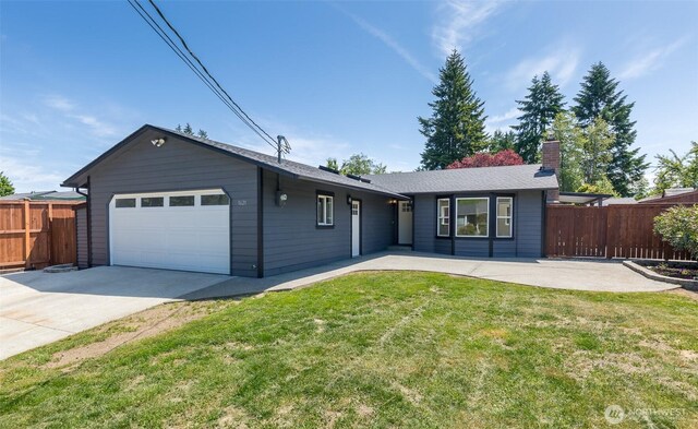9621 1st Ave SE, Everett, WA 98208 - ranch-style house with concrete driveway, a garage, and a chimney